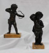 A bronze figure of cupid, on a rectangular marble base,