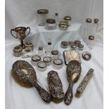 Assorted silver backed dressing table items including clothes brushes, pin cushions,