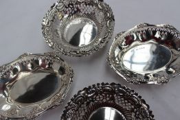 A pair of George V silver bon bon dishes of oval form with a pierced border, Birmingham, 1912,