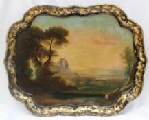 A Victorian papier mache tray, with a raised gilt edge, the centre painted with a landscape scene,