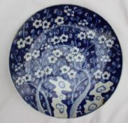 A Chinese porcelain charger decorated in the prunus blossom pattern,