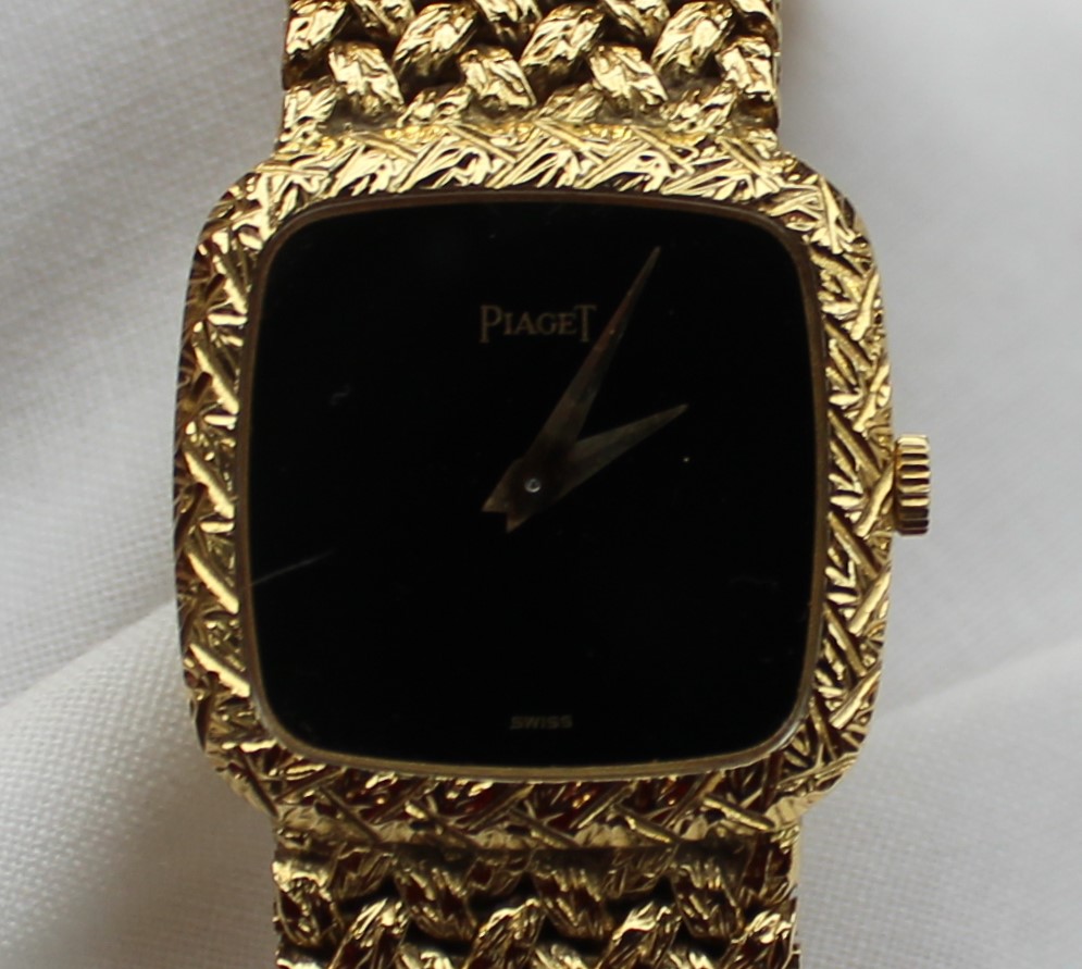 A Lady's 18ct yellow gold Piaget wristwatch, with a black dial and integral bezel and strap, - Image 3 of 5