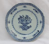 An 18th century Chinese porcelain plate of octagonal form painted to the centre with a vase of