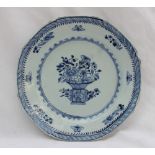 An 18th century Chinese porcelain plate of octagonal form painted to the centre with a vase of