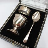 An Elizabeth II silver christening set, comprising an egg cup, napkin ring and spoon, Birmingham,