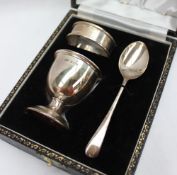 An Elizabeth II silver christening set, comprising an egg cup, napkin ring and spoon, Birmingham,