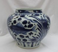 A Chinese porcelain vase decorated with fish and reeds, the base with floral decorated palmettes,