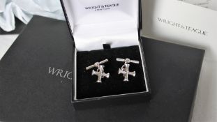 A pair of silver Wright & Teague cufflinks, in the form of a cross with chain links,