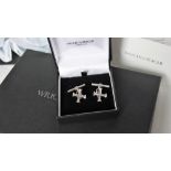 A pair of silver Wright & Teague cufflinks, in the form of a cross with chain links,