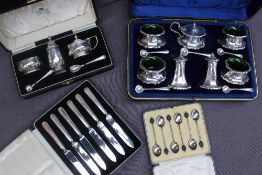 A George V silver cased seven piece silver cruet set, Sheffield,