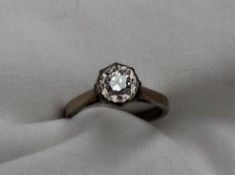 A solitaire diamond ring, the round brilliant cut stone approximately 0.