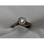 A solitaire diamond ring, the round brilliant cut stone approximately 0.