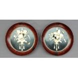 A pair of early 20th century Japanese bone lacquer pictorial wall mounts,
