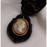 A shell cameo brooch / pendant carved with a lady's head in profile to an unmarked yellow metal