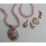 A rose quartz bead necklace and pendant together with a similar bracelet,