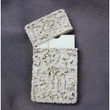 A Cantonese Ivory card case, carved with figures, pagodas and trees, 9.5 x 5.5 x 1.