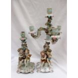 A Meissen style candleabra with three branches encrusted with flowerheads and leaves,
