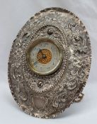 A late Victorian silver cased travelling strut back clock,