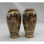 A pair of Japanese satsuma pottery vases decorated with geisha under a cherry blossom tree and