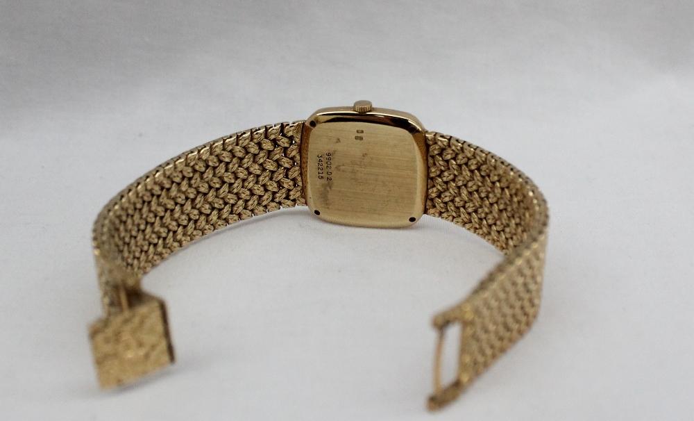 A Lady's 18ct yellow gold Piaget wristwatch, with a black dial and integral bezel and strap, - Image 5 of 5