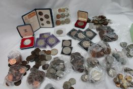 A collection of coins including half crowns, florins, pennies,