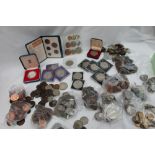 A collection of coins including half crowns, florins, pennies,