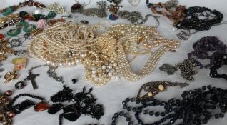 Assorted costume jewellery, including faux pearls, beaded necklaces,