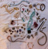 Assorted costume jewellery including brooches, cufflinks, necklaces, faux pearl bracelet,