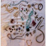 Assorted costume jewellery including brooches, cufflinks, necklaces, faux pearl bracelet,