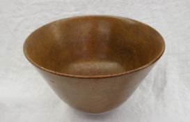 A teak and white metal bowl of flared tapering form on a white metal base marked Newport Sterling