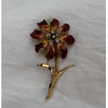 An 18ct yellow gold diamond and enamel decorated brooch, in the form of a flower,