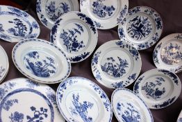 Assorted Chinese porcelain blue and white plates and bowls, decorated with the fence pattern,
