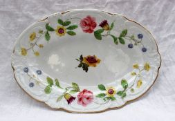 A Nantgarw porcelain oval dish with a moulded scrolling edge,