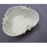 A Belleek porcelain basket weave trefoil dish, applied with roses and buds, strap work mark,