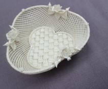 A Belleek porcelain basket weave trefoil dish, applied with roses and buds, strap work mark,