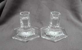 A pair of Tiffany glass candlesticks, with a hexagonal column and similar spreading foot,