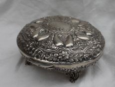 An Indian white metal lidded bowl of oval form,