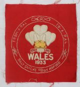 A tapestry panel embroidered with The Prince of Wales Feathers above "Wales 1933",