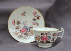 A Swansea porcelain cup and saucer, decorated in the Kingfisher pattern,