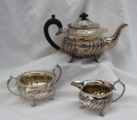 A late Victorian silver three piece teaset, comprising a teapot,