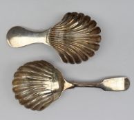 A William IV Scottish silver caddy spoon, with a fiddle pattern handle and shell shaped bowl,