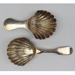 A William IV Scottish silver caddy spoon, with a fiddle pattern handle and shell shaped bowl,