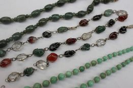 A jade bead necklace together with a hardstone graduated bead necklace,