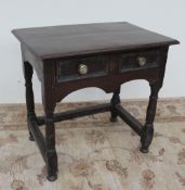 An 18th century oak lowboy,