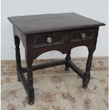 An 18th century oak lowboy,