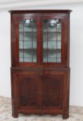 A George III mahogany standing corner cupboard,