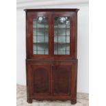 A George III mahogany standing corner cupboard,