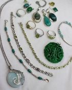 A collection of silver jewellery, gem set with green stones including rings, pendants,