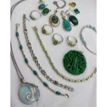 A collection of silver jewellery, gem set with green stones including rings, pendants,