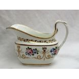 A Swansea porcelain cream jug, painted with roses and gilt swags and a scrolling handle,
